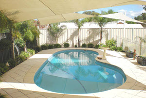 shade sail over a swimming pool